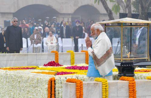 epa11113434 A handout photo made available by  the Indian Press Information Bureau (PIB) shows Indian Prime Minister Narendra Modi paying tribute during an event held to mark the annual 'Martyrs' Day' at the Raj Ghat Mahatma Gandhi memorial, in New Delhi, India, 30 January 2024. The event marks the assassination of the 'Father of the Nation' Mahatma Gandhi,...