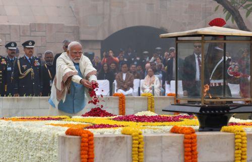 epa11113436 A handout photo made available by  the Indian Press Information Bureau (PIB) shows Indian Prime Minister Narendra Modi paying tribute during an event held to mark the annual 'Martyrs' Day' at the Raj Ghat Mahatma Gandhi memorial, in New Delhi, India, 30 January 2024. The event marks the assassination of the 'Father of the Nation' Mahatma Gandhi,...