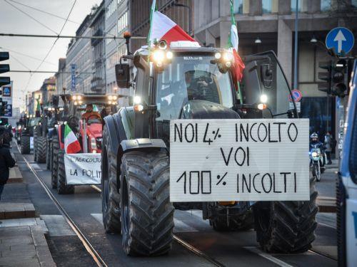epa11118484 Italian farmers arrive with their tractors at the Pirelli skyscraper, seat of the Lombardy Regional Council, during a protest action in Milan, Italy, 01 February 2024. Italian farmers have been protesting against what they say are harmful European agricultural policies, echoing high-profile demonstrations in other parts of Europe, including...