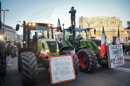 epa11118486 Italian farmers arrive with their tractors at the Pirelli skyscraper, seat of the Lombardy Regional Council, during a protest action in Milan, Italy, 01 February 2024. Italian farmers have been protesting against what they say are harmful European agricultural policies, echoing high-profile demonstrations in other parts of Europe, including...