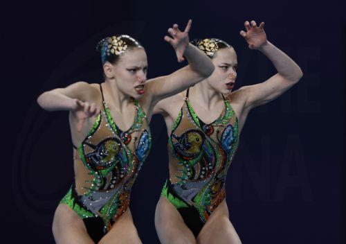 epa11134095 Blanka Barbocz and Angelika Bastianelli of Hungary compete in the women's duet Free preliminaries technical artistic swimming event at the FINA World Aquatics Championships in Doha, Qatar, 07 February 2024.  EPA/MOHAMED MESSARA