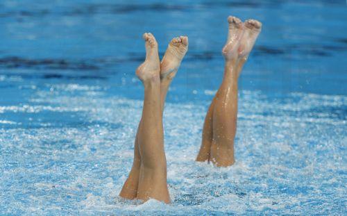 epa11134099 Kyra Hoevertsz and Mikayla Morales of Aruba compete in the women's duet Free preliminaries technical artistic swimming event at the FINA World Aquatics Championships in Doha, Qatar, 07 February 2024.  EPA/MOHAMED MESSARA