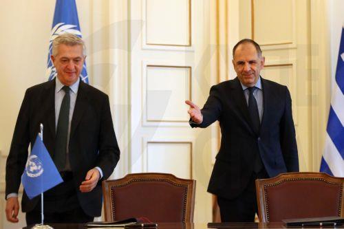 epa11165656 Greek Foreign Minister Giorgos Gerapetritis (R) and  Filippo Grandi (L), UN High Commissioner for Refugees (UNHCR), attend the signing ceremony for the Seat Agreement between Greece and the UN Refugee Agency, after their meeting in Athens, Greece, 19 February 2024. The Agreement will regulate the operating status of the UNHCR office in Greece. ...