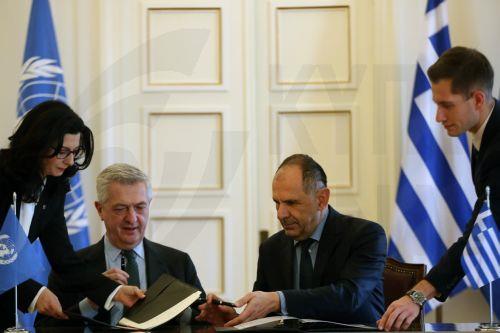 epa11165659 Greek Foreign Minister Giorgos Gerapetritis (C-R) and Filippo Grandi (C-L), UN High Commissioner for Refugees (UNHCR), attend the signing ceremony for the Seat Agreement between Greece and the UN Refugee Agency, after their meeting in Athens, Greece, 19 February 2024. The Agreement will regulate the operating status of the UNHCR office in...