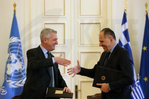 epa11165661 Greek Foreign Minister Giorgos Gerapetritis (R) and Filippo Grandi (L), UN High Commissioner for Refugees (UNHCR), shake hands during the signing ceremony for the Seat Agreement between Greece and the UN Refugee Agency, after their meeting in Athens, Greece, 19 February 2024. The Agreement will regulate the operating status of the UNHCR office...