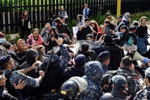 epa11165922 Activists clash with Lebanese riot police during a protest to demand the opening of Rafah border crossing between Egypt and the Gaza Strip, outside of the Egyptian embassy in Beirut, Lebanon, 19 February 2024. Thousands of Israelis and Palestinians have been killed since the militant group Hamas launched an unprecedented attack on Israel from...