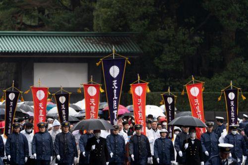 epa11173928 Police officers escort well-wishers arriving for the appearance of Emperor Naruhito at the Imperial Palace in Tokyo, Japan, 23 February 2024. Emperor Naruhito appeared to greet the public on his 64th birthday, flanked by Empress Masako and other members of the Japanese Royal Family.  EPA/Tomohiro Ohsumi / POOL