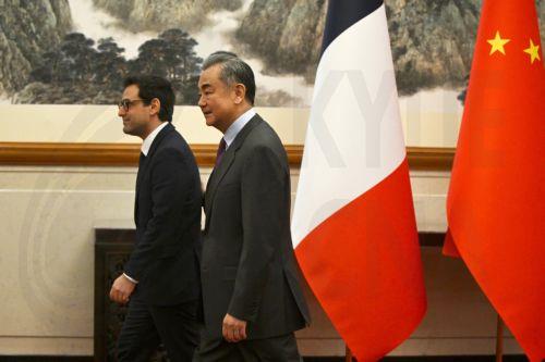 epa11254078 French Minister for Foreign and European Affairs Stephane Sejourne (L) walks with China's Foreign Minister Wang Yi during a meeting at the Diaoyutai State Guest House in Beijing, China, 01 April 2024.  EPA/Pedro Pardo / POOL