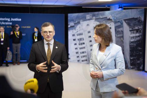 epa11255281 Dutch Minister of Foreign Affairs Hanke Bruins Slot (R) receives Ukrainian Foreign Minister Dmytro Kuleba (L) for the conference on support to Ukraine in the Hague, the Netherlands, 02 April 2024.  The Netherlands, Ukraine and the European Commission are holding an international conference on the war in Ukraine in the World Forum conference...