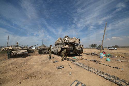 epa11265632 Israeli Soldiers from Unit 98 perform maintenance work on their tanks after withdrawing from Khan Yunis in the southern Gaza Strip, at an undisclosed location near the Gaza border, Israel, 08 April 2024. Six months after the 07 October Hamas attacks on Israel, the Israeli army announced on 07 April its partial withdrawal from parts of the...