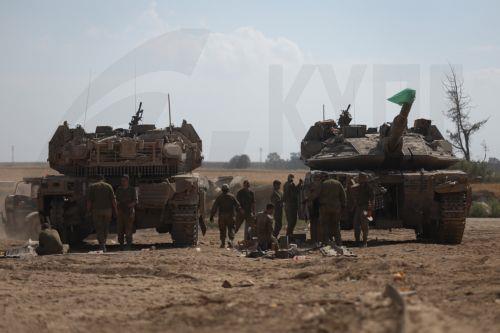 epa11265655 Israeli Soldiers from Unit 98 perform maintenance work on their tanks after withdrawing from Khan Yunis in the southern Gaza Strip, at an undisclosed location near the Gaza border, Israel, 08 April 2024. Six months after the 07 October Hamas attacks on Israel, the Israeli army announced on 07 April its partial withdrawal from parts of the...