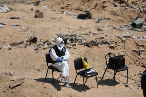 epa11265674 A Palestinian Health Ministry's crew member rests during an operation to search for possible bodies among the rubble after the Israeli army had left the Al-Shifa Medical Hospital Complex in Gaza City, 08 April 2024. According to the Israeli army spokesperson, approximately 500 suspects affiliated with Hamas were apprehended and 200 were...