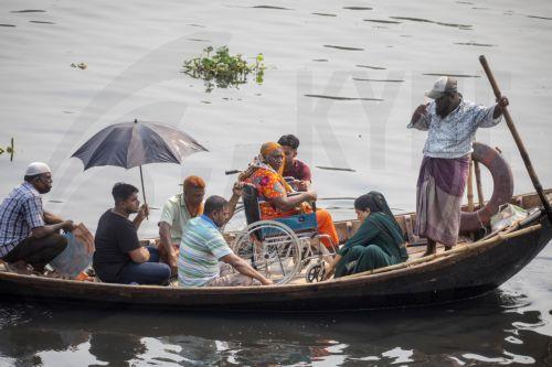 epa11279680 Bangladeshi people cross the Buriganga River by boat during the heatwave in Dhaka, Bangladesh, 15 April 2024. The Bangladesh Meteorological Department (BMD) on 15 April warned that the mild to moderate heatwave that has been sweeping over Rajshahi, Dhaka, Khulna, Barisal, Chittagong and Sylhet divisions will continue for the next five days. ...