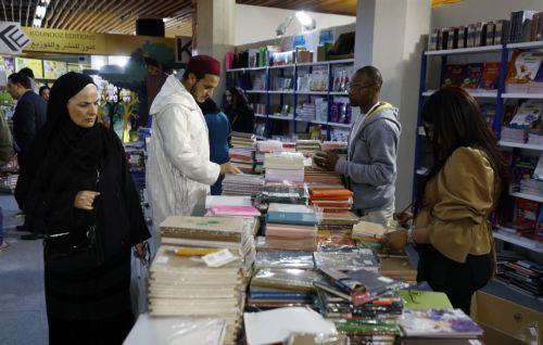 epa11289400 People visit the 38th Tunis International Book Fair, in Tunis, Tunisia, 19 April 2024. The book fair's 38th edition runs in Tunis from 19 to 28 April 2024, with the participation of 319 exhibitors from 25 different countries, including 161 Tunisians and 158 foreigners and Arabs. Egypt tops the list with 94 exhibitors participating in the event. ...