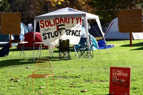 epa11349228 A banner hangs from a tent at a pro-Palestinian encampment at the University of Melbourne in Melbourne, Australia 18 May 2024. A protest stand-off at a Melbourne university continues as universities around the nation refuse to give into the demands of pro-Palestinian demonstrators.  EPA/CON CHRONIS AUSTRALIA AND NEW ZEALAND OUT