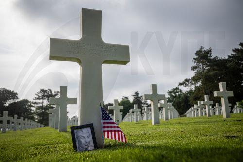epa11387452 A US flag and portrait are placed at the grave of the late US soldier James Walker at the American Cemetery ahead of the 80th D-Day anniversary, in Colleville-sur-Mer, Normandy, France, 03 June 2024. World leaders are due to attend memorial events in Normandy, France on 06 June 2024 to mark the 80th anniversary of the D-Day landings, when allied...
