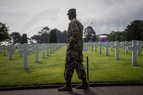 epa11387455 A US soldier looks at the graves at the American Cemetery ahead of the 80th D-Day anniversary, in Colleville-sur-Mer, Normandy, France, 03 June 2024. World leaders are due to attend memorial events in Normandy, France on 06 June 2024 to mark the 80th anniversary of the D-Day landings, when allied forces invaded German controlled France. ...