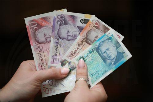 epa11390607 A handout photo taken 03 June 2024 made available by the Bank of England shows newly issued banknotes featuring the portrait of King Charles III, in London, Britain, 05 June 2024. Banknotes carrying a portrait of King Charles III will be issued for circulation the first time on 05 June 2024. The portrait of King Charles III will appear on...