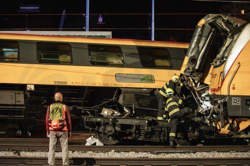 epa11392387 Firefighters work in the aftermath of a train crash in the city of Pardubice, Czech Republic, 05 June 2024. An express train and a freight train collided head-on in Pardubice late 05 June evening. According to a spokeswoman for the Pardubice rescue service, Alena Kisial, four people have died at the scene, Czech Television is reporting. Dozens...