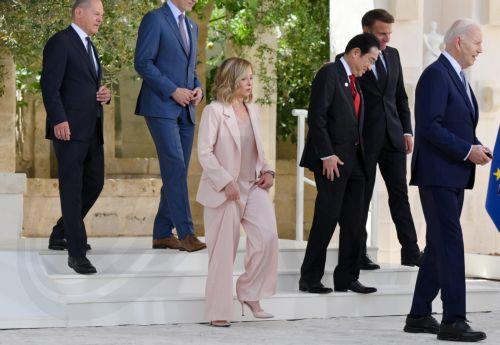 epa11407683 Italy's Prime Minister Giorgia Meloni (C) walks with German Chancellor Olaf Scholz (L), Canadian Prime Minister Justin Trudeau (2-L), Japan's Prime Minister Fumio Kishida (3-R), French President Emmanuel Macron (2-R) and US President Joe Biden (R) at the end of a welcome ceremony for the G7 summit in Borgo Egnazia, southern Italy, 13 June 2024....