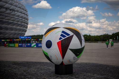 epa11407894 A giant official soccer ball replica on display outside the Allianz Arena, on the eve of the UEFA EURO 2024 opening match between Germany and Scotland, in Munich, Germany, 13 June 2024. The UEFA EURO 2024 runs from 14 June to 14 July in Germany.  EPA/MARTIN DIVISEK