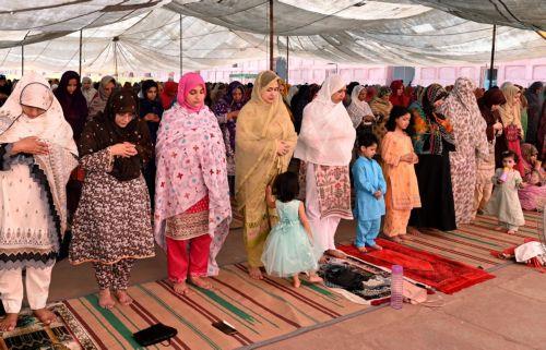 epa11417914 Muslims gather to perform Eid al-Fitr prayers at the historic Badshahi Mosque in Lahore, Pakistan, 17 June 2024. Eid al-Adha is the holiest of the two Muslim holidays celebrated each year. It marks the yearly Muslim pilgrimage (Hajj) to visit Mecca, the most sacred place in Islam. Muslims slaughter a sacrificial animal and split the meat into...
