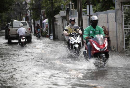 epa11581488 People ride their motorcycles through floodwater during a downpour in Bangkok, Thailand, 03 September 2024. The Thai Meteorological Department issued a public warning for heavy downpour to very heavy rainfall and advised residents to be observant of flash floods in Bangkok and across Thailand caused by moderate monsoon weather patterns. ...