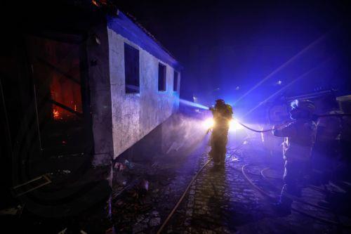 epa11608827 Firefighters fight a forest fire in Zimao, Vila Pouca de Aguiar, Portugal, 16 September 2024. The situation has worsened in the fire in Vila Pouca de Aguiar, which is approaching the village of Vila Mea, said the mayor today, who asked for more resources to fight the three fires in the municipality. 99 operatives and 32 vehicles are fighting the...