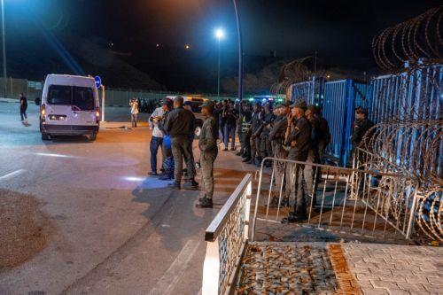 epa11608878 Moroccan public security forces deploy near a customs checkpoint along the land border with the Spanish enclave of Ceuta, in Fnideq, northern Morocco, 16 September 2024. Hundreds of migrants on 15 September stormed a barbed wire fence to cross the land border from Fnideq to Ceuta, following a call on social media for a mass migration attempt,...