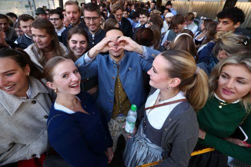 epa11616770 Visitors in traditional costumes lineup for the opening of the 189th edition of the traditional Oktoberfest beer and amusement festival in the Bavarian capital Munich, Germany, 21 September 2024. According to its organizers, the Oktoberfest has grown into the world's largest folk festival, drawing around six million visitors annually. The...