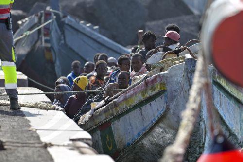 epaselect epa11619723 A small wooden boat ('cayuco') carrying some of the 127 sub-Saharan migrants that have been rescued by search & rescue vessel 'Guardamar Caliope' is pictured upon its arrival to La Restinga harbor on El Hierro island, the Canaries, Spain, 22 September 2024.  EPA/GELMERT FINOL