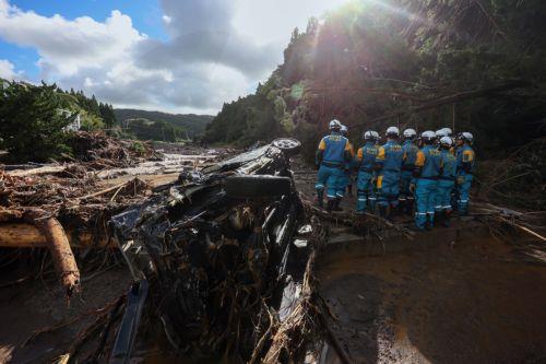 epa11620082 Police officers search for missing persons in Wajima, Ishikawa Prefecture, Japan, 23 September 2024. According to latest reports from Ishikawa prefecture, six people died after torrential rains triggered floods and landslides in areas already affected by the major New Year's Day's earthquake.  EPA/JIJI PRESS JAPAN OUT EDITORIAL USE ONLY/