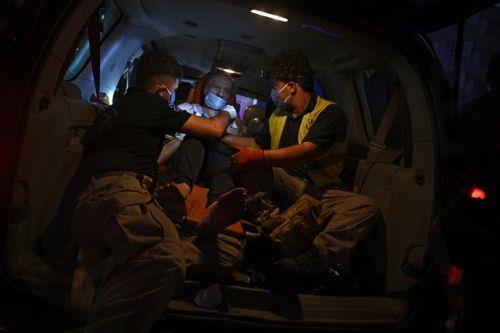 epa11628922 Ambulance carries injured following an Israel strike in Danieh, Beirut, Lebanon, 27 September 2024. The Israeli military (IDF) announced in a statement that they have "carried out a precise strike on the Central Headquarters of the Hezbollah" on 27 September. The headquarters were "intentionally built under residential buildings in the heart of...