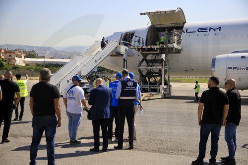 epa11641318 Workers carry out aids, medicines, and medical supplies provided by the World Health Organization (WHO) from a plane at Beirut airport, in Beirut, Lebanon, 04 October 2024. Lebanese Minister of Health, Firas Abiad, announced on 03 October, that 1,974 people have been killed, including 127 children and 261 women, and 9,384 others have been...