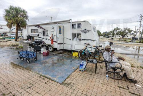 epa11650010 'Smoky' (79), waits for a truck to help him move his mobile home to a safer place in San Carlos Island, Fort Myers beach, as the city prepares for Hurricane Milton in Bonita Beach, Florida, USA, 08 October 2024. According to the National Hurricane Center's Live Hurricane Tracker, Hurricane Milton is set to make landfall on the west coast of...