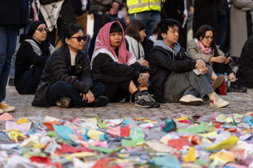 epa11654335 Community members gather for a Free Palestine Melbourne vigil to remember victims of the Gaza attacks at Federation Square in Melbourne, Australia, 11 October 2024. A Free Palestine Melbourne vigil is taking place at Federation Square, where community members are gathering to remember victims of Israeli attacks in Gaza.  EPA/DIEGO FEDELE...