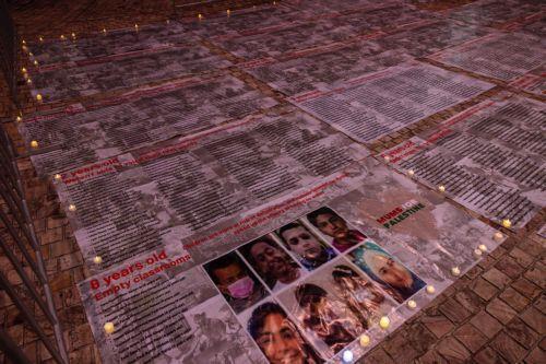 epa11654332 Community members gather for a Free Palestine Melbourne vigil to remember victims of the Gaza attacks at Federation Square in Melbourne, Australia, 11 October 2024. A Free Palestine Melbourne vigil is taking place at Federation Square, where community members are gathering to remember victims of Israeli attacks in Gaza.  EPA/DIEGO FEDELE...