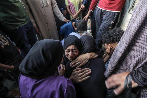 epa11657998 Relatives of killed one-and-a-half-year old baby Yaman Al Zaneen mourn during his funeral in Deir al Balah, central Gaza Strip, 14 October 2024. According to the Palestinian Ministry of Health, 23 people, including children, were killed after a school sheltering internally displaced Palestinians in Nuseirat camp was struck by an Israeli attack...
