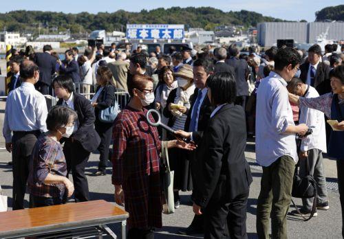epa11659862 Police officers control attendees before the arrival of Japanese Prime Minister Shigeru Ishiba at an election campaign rally at Onahama Fish Market in Iwaki, Fukushima prefecture, northeastern Japan, 15 October 2024. Prime Minister Ishiba made his first speech at the kick-off of the official campaigning for the 27 October general election in...