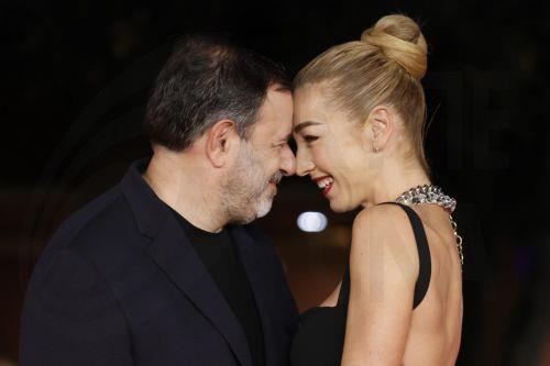 epa11665059 Italian director Fausto Brizzi (L) and Silvia Salis arrive for the screening of the movie 'Paradiso in Vendita' at the 19th annual Rome International Film Fest in Rome, Italy, 17 October 2024. The Festa del Cinema di Roma runs from 16 to 27 October 2024.  EPA/FABIO FRUSTACI