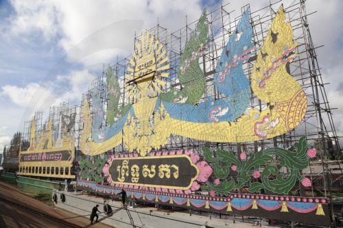 epa11668000 Cambodian workers install lights on a large boat in preparation for the annual Water Festival celebrations on the Tonle Sap River in Phnom Penh, Cambodia, 19 October 2024. The festival will see boat team from across Cambodia compete in races on the Mekong River. Water festival will run from 14 to 16 November 2024.  EPA/KITH SEREY