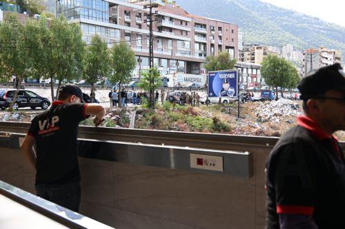 epa11668091 A workers clears broken glass near the site of a drone attack in Sahel Alma, north Beirut, Lebanon, 19 October 2024. According to Lebanon's National News Agency (NNA), two people were killed after an Israeli drone targeted their car on the Jounieh highway before pursuing them in the forest adjacent to the highway. Two others were injured in the...