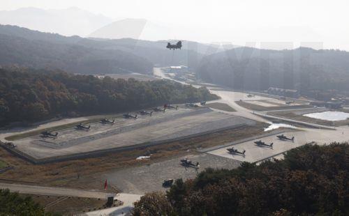 epa11691750 US and South Korean AH-64E Apaches take part in the 2nd Combat Aviation Brigade, 2nd Infantry Division/Republic of Korea (ROK) - United States Combined Division, live-fire drills with the 901st Aviation Battalion of the South Korea Army at Rodriguez live fire range in Pocheon, South Korea, 30 October 2024.  EPA/JEON HEON-KYUN