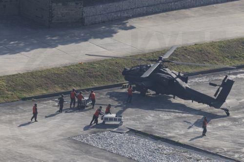 epa11691749 South Korean soldiers work next to an AH-64E Apache in the 2nd Combat Aviation Brigade, 2nd Infantry Division/Republic of Korea (ROK) - United States Combined Division, live-fire drills with the 901st Aviation Battalion of the South Korea Army at Rodriguez live fire range in Pocheon, South Korea, 30 October 2024.  EPA/JEON HEON-KYUN