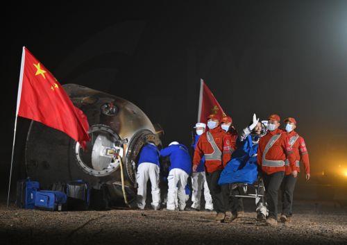 epa11700209 Chinese astronaut Li Cong (3-R) waves as he is carried out of the return capsule of the Shenzhou-18 manned spaceship at the Dongfeng landing site in north China's Inner Mongolia Autonomous Region, 04 November 2024. All three astronauts of the Shenzhou-18 manned mission - Ye Guangfu, Li Cong and Li Guangsu - emerged from the return capsule in...