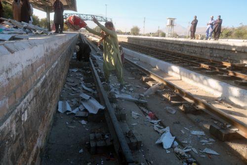 epa11714121 Railway workers clear the scene of a suicide bomb blast at a railway station in Quetta, the provincial capital of restive Balochistan province, Pakistan, 11 November 2024. A suicide bombing on 09 November at a train station in Quetta, Pakistan, has claimed the lives of at least 24 people, including law enforcement personnel, as a Peshawar-bound...