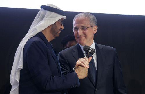 epaselect epa11714129 COP28 President Sultan Al Jaber (L) passes the hammer to COP29 President Mukhtar Babayev (R) during the opening ceremony of the UN Climate Change Conference (COP29) in Baku, Azerbaijan, 11 November 2024. The Azerbaijani capital of Baku hosts the 2024 United Nations Climate Change Conference (COP29) from 11 to 22 November 2024. ...
