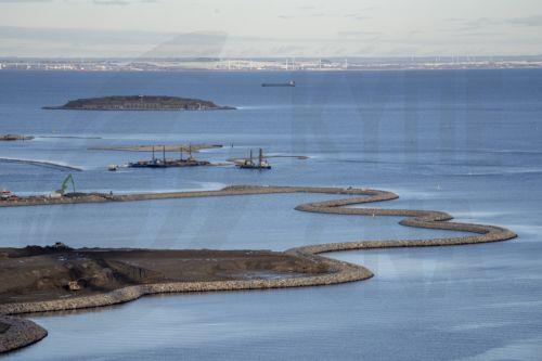 epa11733205 The construction of Lynetteholmen peninsula as seen from Copenhill in Copenhagen, Denmark, 21 November 2024. Lynetteholmen is a planned artificial peninsula in Copenhagen which is expected to be completed in 2070. The peninsula will provide additional space for around 35, 000 residents and will also protect Copenhagen against rising water...