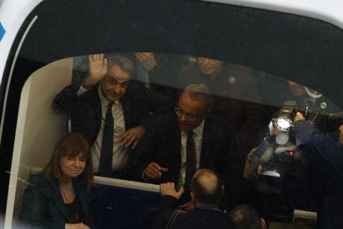 epa11749170 Greek President Katerina Sakellaropoulou (R-front), Prime Minister Kyriakos Mitsotakis (R-back) and the Minister of Infrastructure and Transport Christos Staikouras (2-R) ride a subway coach during the inauguration ceremony for the delivery of the METRO Thessaloniki project, at the Pylaia station, where a state-of-the-art control center for its...