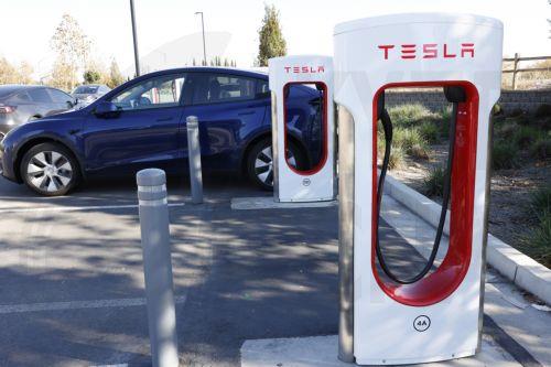 epa11755696 Tesla SuperChargers in Livermore, California, USA, 03 December 2024. Tesla Superchargers were only open to Tesla drivers until this year, when electric vehicle (EV) owners of Ford, Rivian and General Motors were given access by using an adapter to unlock access to the Tesla EV chargers. Other EVâ€™s by other companies will come later.  EPA/JOHN...